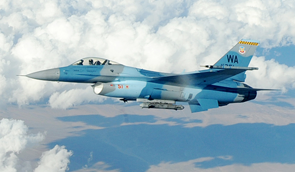 An F-16 Fighting Falcon Aggressor flies over the Nevada Test and Training Range after being refueled by an Ohio Air National Guard KC-135 Stratotanker Oct. 19, 2009, during Red Flag 10-01. Air Force photo by Airman 1st Class Jamie Nicley
