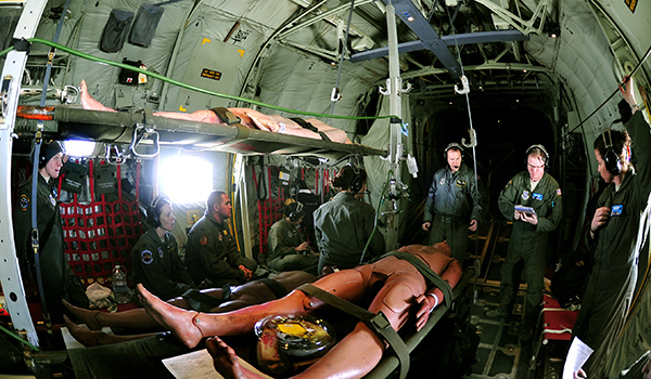 Active-duty airmen and Air National Guard Aeromedical Evacuation members train on a C-130 Hercules aircraft during Ultimate Caduceus 2014, a national disaster exercise similar to Turbo Challenge. During Ultimate Caduceus, airmen provide medical support and process and transfer patients during simulated disaster relief operations. Air Force photo by Staff Sgt. Stephenie Wade
