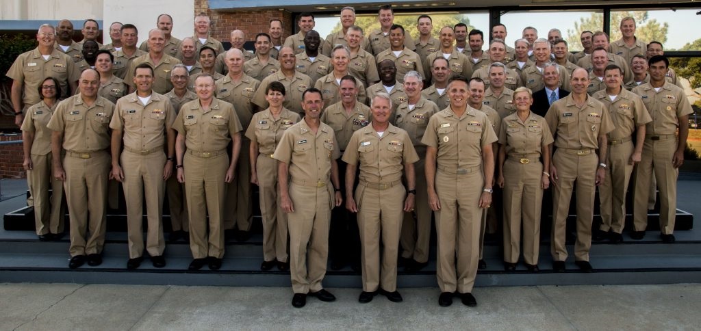 SAN DIEGO (Aug. 10, 2016) Chief of Naval Operations (CNO) Adm. John Richardson, Adm. Phil Davidson, commander, U.S. Fleet Forces, and Vice Adm. Tom Rowden, commander, Naval Surface Forces, pose for a group photo with the attendees of the annual Surface Warfare Flag Officers Training Symposium (SWFOTS).  U.S. Navy photo by Mass Communication Specialist 2nd Class Phil Ladouceur/Released 