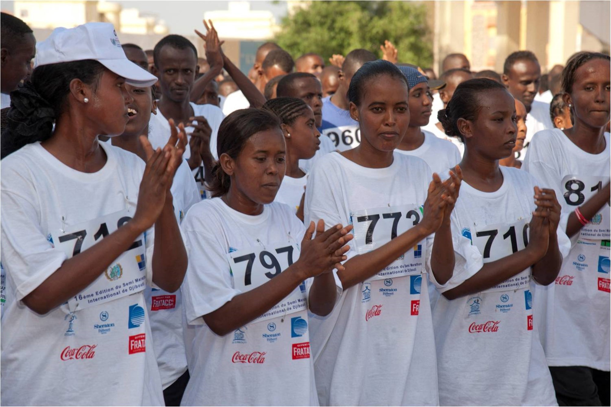 DJIBOUTI, Djibouti (March 2, 2012) - Runners clap along to music played by Djibouti's Musique Nationale band before the 16th Annual Djibouti International Semi-Marathon here March 2. More than 40 U.S. service members and civilians from Camp Lemonnier, Djibouti, ran alongside 800 other international runners during the event.  (U.S. Air Force photo by Technical Sergeant Ryan Labadens)