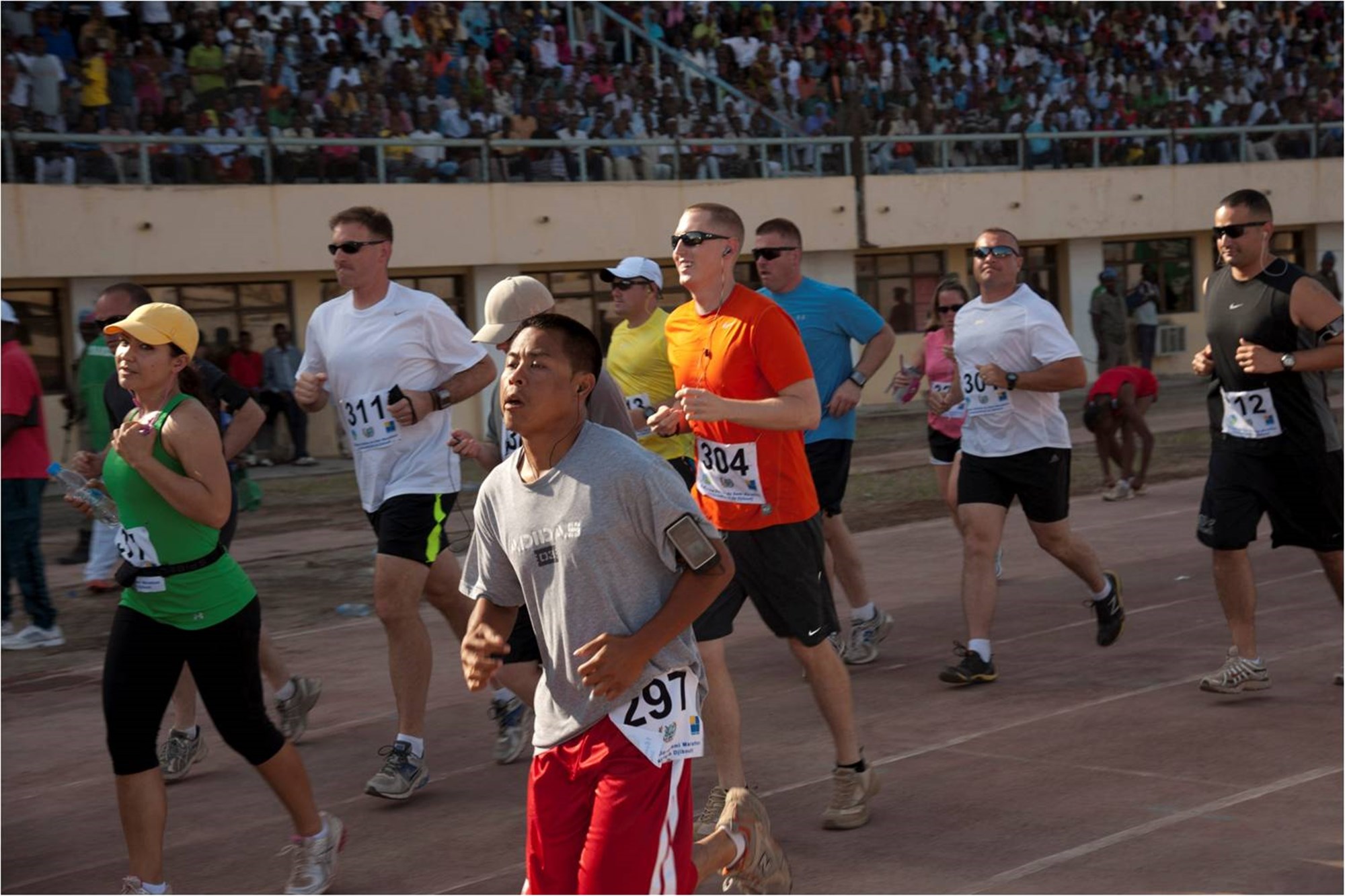 DJIBOUTI, Djibouti (March 2, 2012) - U.S. personnel from Camp Lemonnier run past the starting line at the 16th Annual Djibouti International Semi-Marathon here March 2. More than 40 U.S. service members and civilians from Camp Lemonnier, Djibouti, ran alongside 800 other international runners during the event. (U.S. Air Force photo by Technical Sergeant Ryan Labadens)