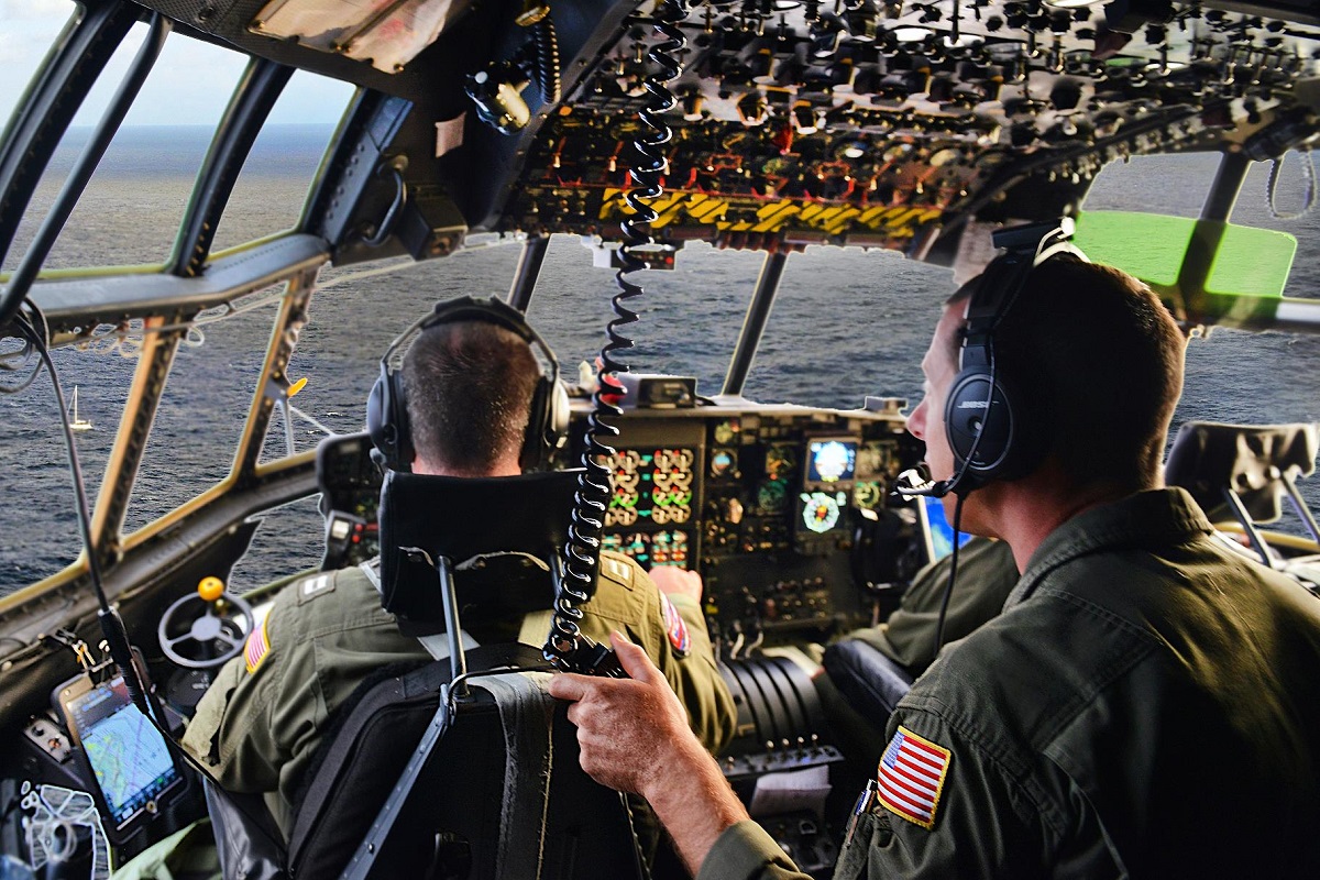 The crew of an HC-130 Hercules airplane sights the 45-foot sailing vessel Second Chance and makes radio contact with the six people aboard in the Pacific Ocean, July 10, 2016. The Hercules crew managed communications for a Navy SH-60 Seahawk helicopter crew on a medevac mission for a 58-year-old mariner off Oahu, Hawaii. Coast Guard photo by Chief Petty Officer Sara Mooers 
