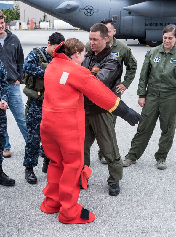 A language student from Center for Information Dominance Unit Monterey tries on cold weather gear as part of a static display from Fleet Air Reconnaissance Squadron (VQ) 1. Photo courtesy of U.S. Navy.