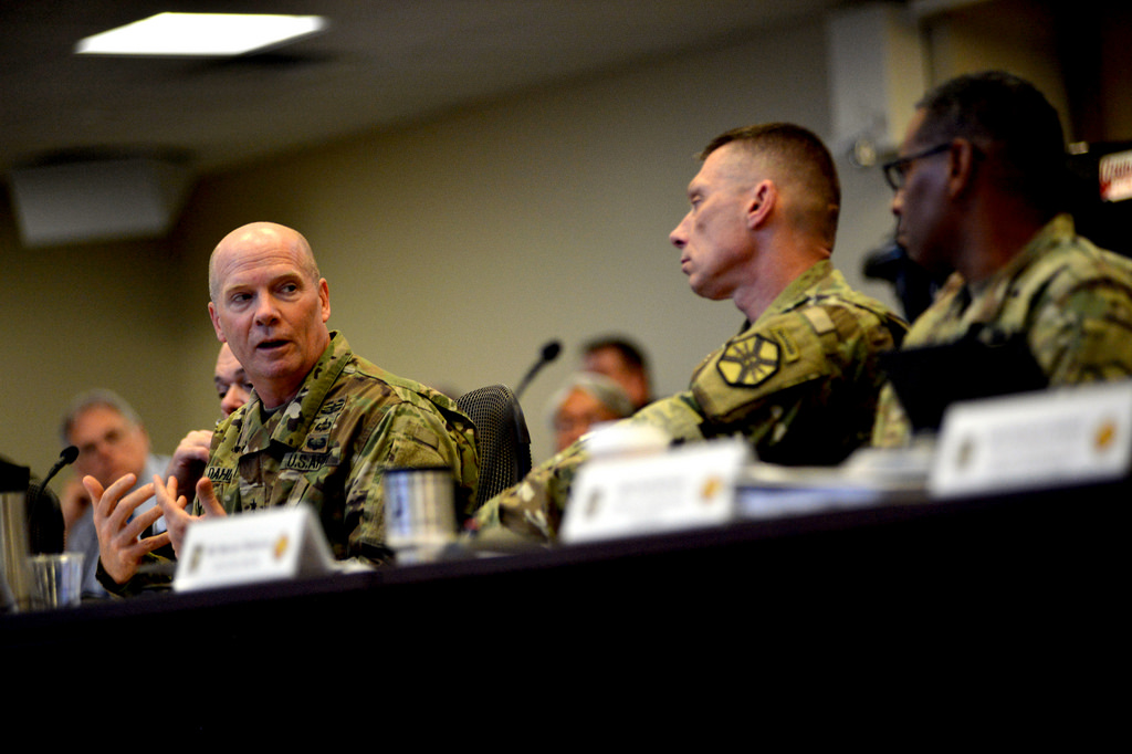 Lt. Gen. Kenneth Dahl (left), Commanding General of U.S. Army Installation Management Command, confers with IMCOM Command Sgt. Maj. Jeffrey Hartless (center) and IMCOM Deputy Commanding General for Operations and Chief of Staff for IMCOM Maj. Gen. Lawarren Patterson (right) during Cyber Installation Support Summit VI at the U.S. Army Installation Management Command Headquarters Operations Center, March 30, at Fort Sam Houston, Texas