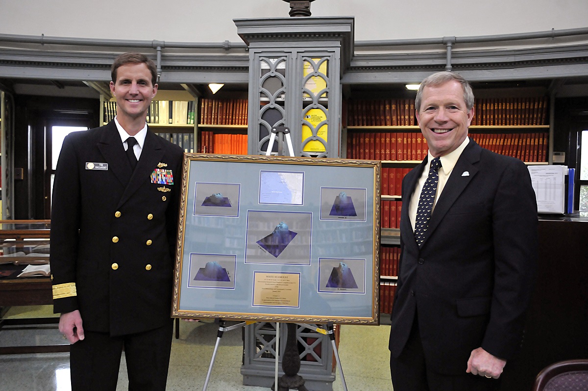 Oceanographer of the Navy Rear Adm. Tim Gallaudet, left, poses with former oceanographer of the Navy retired Rear Adm. Jon White during a ceremony in honor of an undersea mountain named after White.  U.S. Navy photo by Brian Leshak 