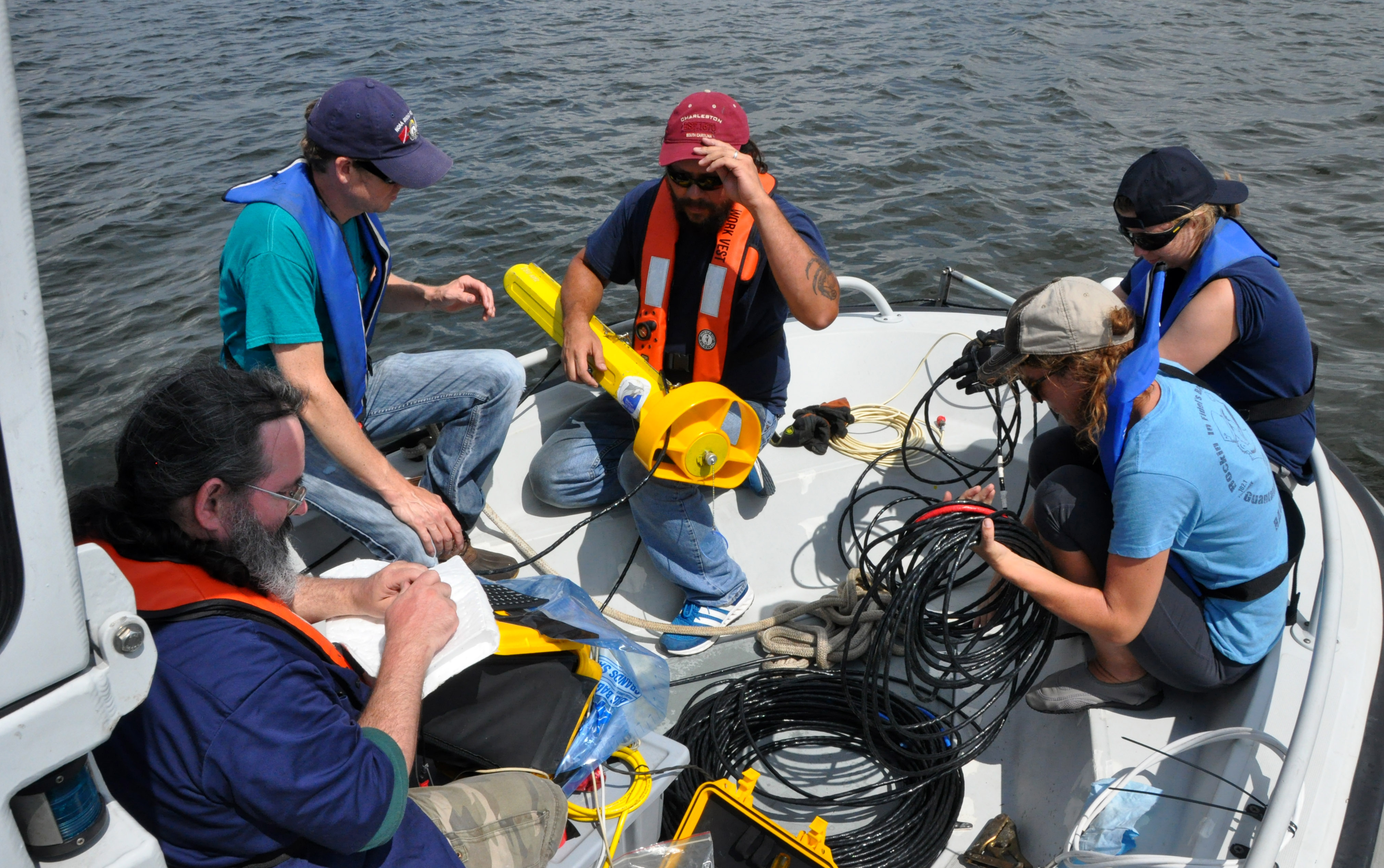 Members of Naval History and Heritage Command’s Underwater Archaeology Branch, in partnership with Phoenix International Holdings, Inc. and Supervisor of Navy Diving and Salvage, prepare archaeological survey equipment while in the Chesapeake Bay, Aug. 20. The team surveyed the Bay to potentially identify aircraft wreck sites in the area. Photo courtesy of U.S. Navy.