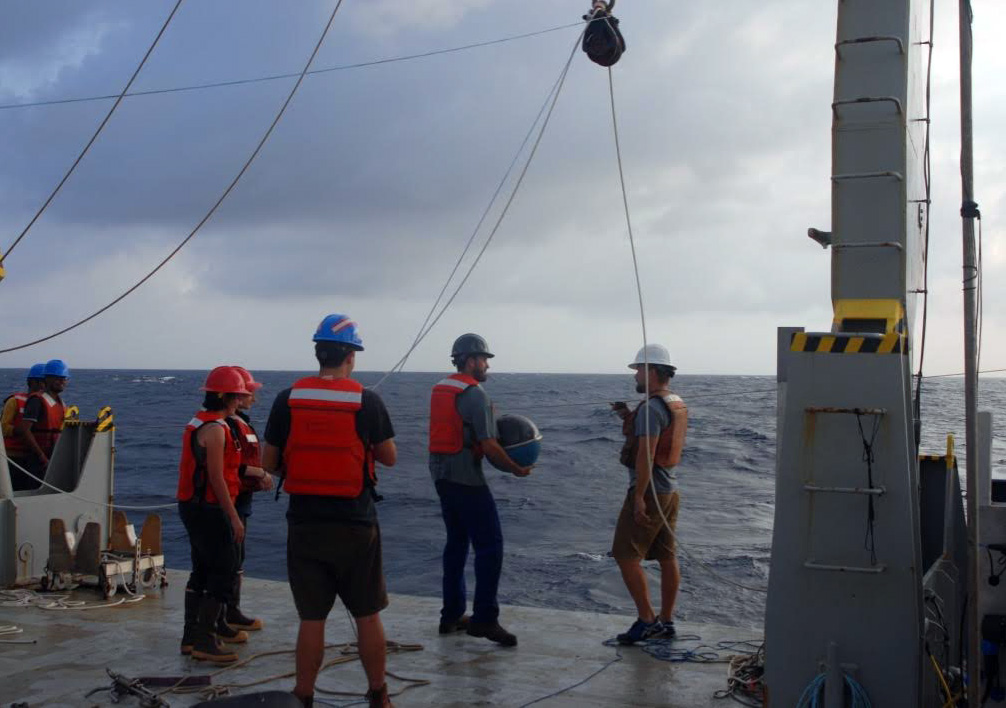 U.S. and Indian scientists aboard the research vessel Roger Revelle deploy a wave buoy to measure upper ocean density and velocity in the Bay of Bengal. The month-long mission aboard the Office of Naval Research-owned vessel centered on monsoon prediction. Photo courtesy of the R/V Roger Revelle 