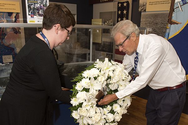 NORFOLK (Aug. 15, 2015) Susanne Greene, a public information specialist at Hampton Roads Naval Museum, and Retired Capt. Lee Duckworth, the museum's director of education, lay a wreath during a Spirit of '45 wreath-laying ceremony at Hampton Roads Naval Museum. Congress created the Spirit of '45 commemoration in 2010 to celebrate the end of World War II and honor the men and women who served during the war. U.S. Navy photo by Mass Communication Specialist 3rd Class Shelby Tucker.