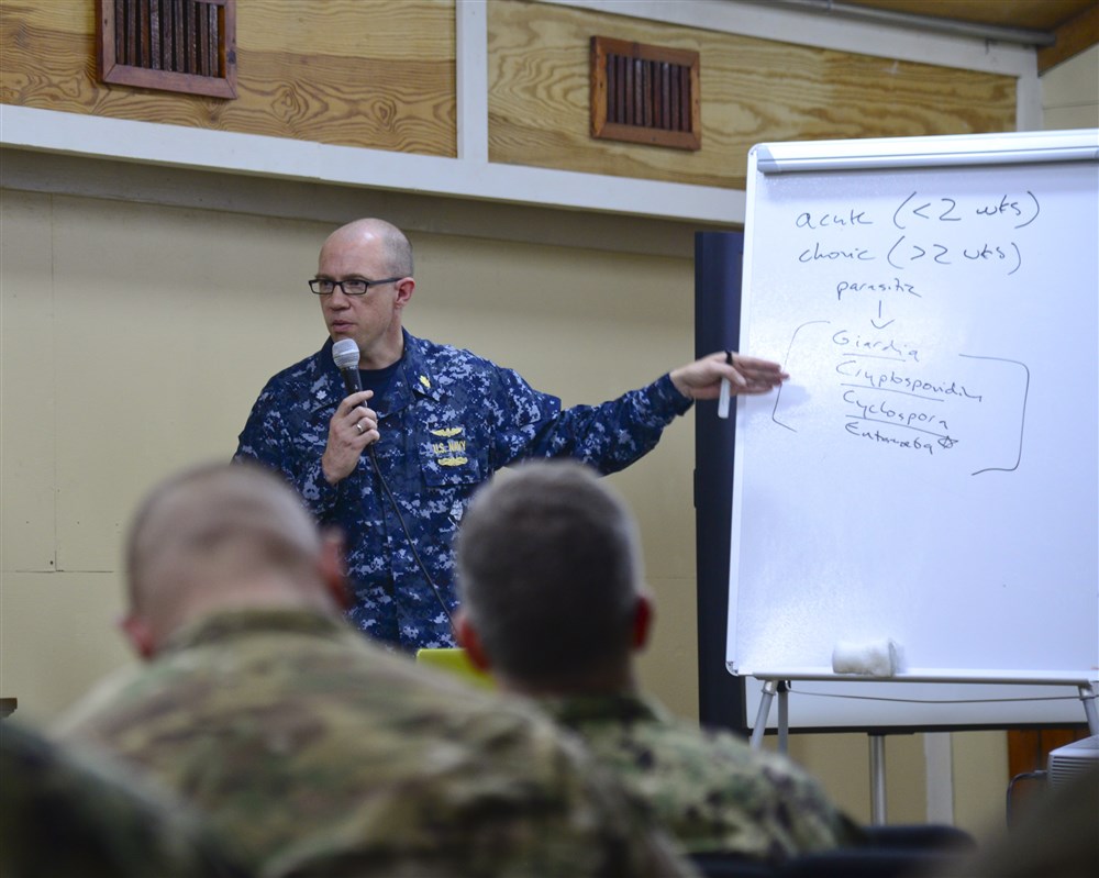 U.S. Navy Commander Ryan Maves, physician of infectious diseases, teaches medical professionals about illnesses during the Military Tropical Medicine seminar May 11, 2016 at Camp Lemonnier, Djibouti. Medical specialists from the U.S., France, Germany, Italy and Djibouti attended the seminar to learn about treating tropical illnesses and diseases and how they affect military personnel in a contingency environment.  (U.S. Air Force photo by Senior Airman Benjamin Raughton/Released)