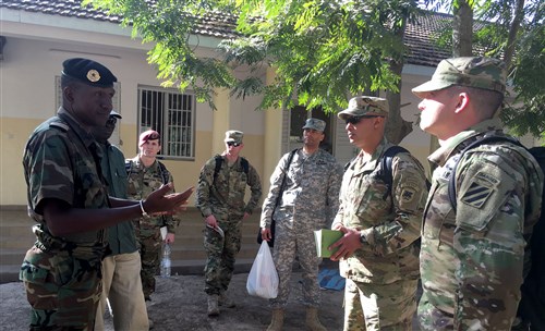 Maj. Michael Gacheru, U.S. Army Africa, and Capt. Michael Kearnes, 1st Battalion, 30th Infantry Regiment, are briefed at the Senegalese training facility where the African Readiness Training 2016 exercise will take place. (U.S. Army Africa photo by Capt. Anielka DiFelice)