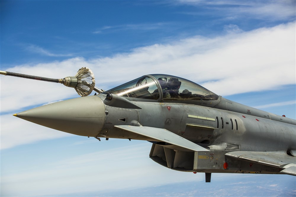 A Eurofighter Typhoon with the Spanish Air Force based out of Morón Air Base, Spain, refuels from a KC-130J Hercules, a first for the Marines from Special-Purpose Marine Air-Ground Task Force Crisis Response-Africa, Aug. 13, in Spain. The U.S. and Spain have been fostering one of the closest defense partnerships around the world for more than 60 years. (U.S. Marine Corps photo by Staff Sgt. Vitaliy Rusavskiy/Released)