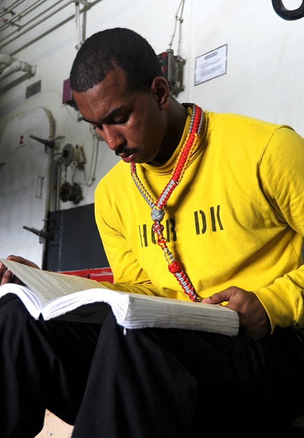 ARABIAN GULF (Aug. 26, 2014) Aviation Boatswain's Mate (Handling) 3rd Class James Carson, from Ozark, Ala., studies for the upcoming advancement exam aboard the aircraft carrier USS George H.W. Bush (CVN 77). George H.W. Bush is supporting maritime security operations and theater security cooperation efforts in the U.S. 5th Fleet area of responsibility. U.S. Navy photo by Mass Communication Specialist 3rd Class Lorelei Vander Griend.