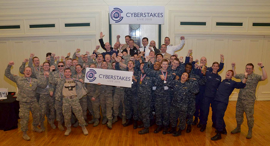 Sixty cadets and midshipmen from the service academies pose for a group photo during the second annual Defense Advanced Projects Research Agency’s Service Academy CyberStakes Live event held at the Soldiers and Sailors Memorial Hall and Museum in Pittsburgh, Jan. 30 to Feb. 1, 2015. The decathlon-style computer-security competition pitted teams from each school head to head over three days to support the Defense Department's goal of integrating 6,000 cybersecurity experts into combat commands by 2016. DARPA photo  