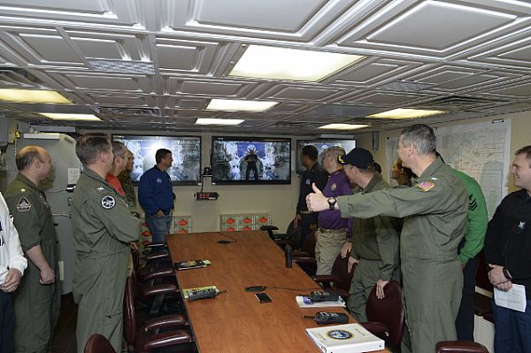 ATLANTIC OCEAN (Jan. 26, 2015) Capt. Daniel C. Grieco, commanding officer of the Nimitz-class aircraft carrier USS Theodore Roosevelt (CVN 71), gives a thumbs up to Capt. Barry "Butch" Wilmore, an astronaut aboard the International Space Station, during a video teleconference aboard Theodore Roosevelt. Wilmore fielded questions from the Theodore Roosevelt  crew during the event. Theodore Roosevelt  is underway participating in a composite training unit exercise (COMPTUEX), which tests the Theodore Roosevelt Carrier Strike Group's ability to effectively react to real-world scenarios and perform as an integrated unit. U.S. Navy photo by Mass Communication Specialist 2nd Class Chris Brown.