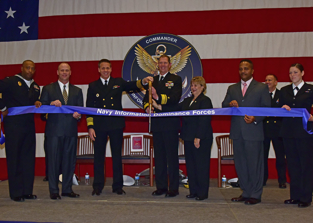 SUFFOLK, Va. (Jan. 28, 2015) Adm. Phil Davidson, commander,  U.S. Fleet Forces, Rear Adm. Matthew Kohler, commander, Navy Information Dominance Forces, the Honorable Linda Johnson, LS1 Calvin Lewis and IT3 Amber Kochishan, cut a ribbon to mark the establishment of Navy Information Dominance Forces Command. The ceremony commemorated the establishment of the Navy's newest global Type Command responsible for man, train and equip missions of all Navy Information Dominance capabilities afloat and ashore. U.S. Navy Photo by Mass Communication Specialist 1st Class Erik Wehnes.