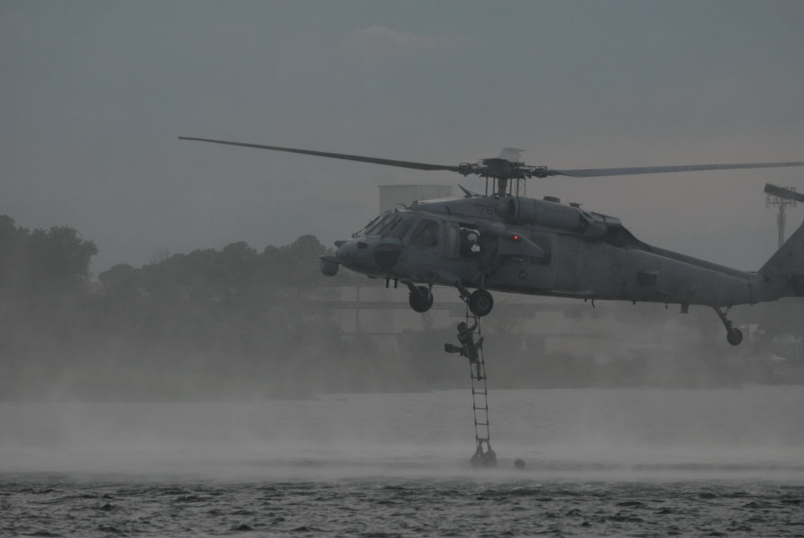 VIRGINIA BEACH, Va. (Aug. 15, 2013) East coast-based Navy SEALs climb a Jacob's Ladder during helocast and recovery training at Joint Expeditionary Base Little Creek-Fort Story. U.S. Navy photo by Mass Communication Specialist 2nd Class Meranda Keller.