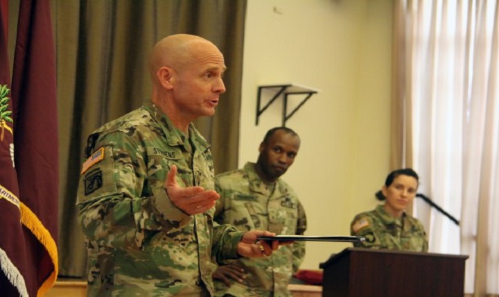 After being presented the National Defense University Certificate of Appreciation during a September awards ceremony for the lifesaving efforts provided to retired Gen. Mike Carns, Brig. Gen. Ronald T. Stephens, deputy commanding general, Regional Health Command-Pacific, briefly recounted the events that took place on Aug. 10, 2016. Brig. Gen. Bertram C. Providence, commanding general, RHC-P, middle, and Maj. Kathryn LoFranco, deputy executive officer, RHC-P, look on. (Photo Credit: Mrs. Flavia Hulsey (Regional Health CommandPacific))