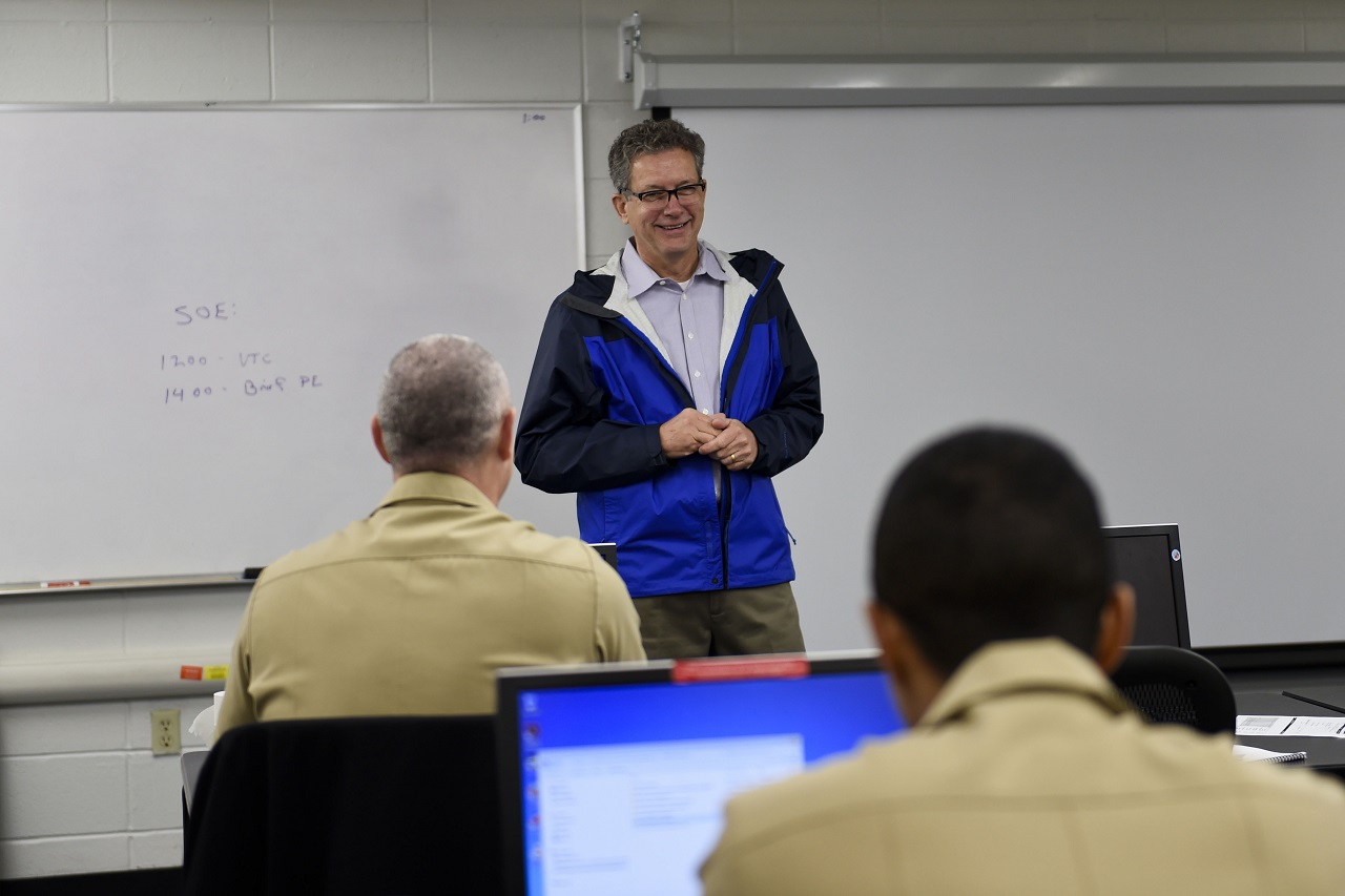 PENSACOLA, Fla. (Dec. 9, 2016) Retired Capt. James Hagy speaks to students attending the Cryptologic Warfare Officer Basic Course at Information Warfare Training Command Corry Station. Hagy retired from the Navy in 2014 after 40 years of service. U.S. Navy photo by Petty Officer 2nd Class Taylor L. Jackson/Released 

