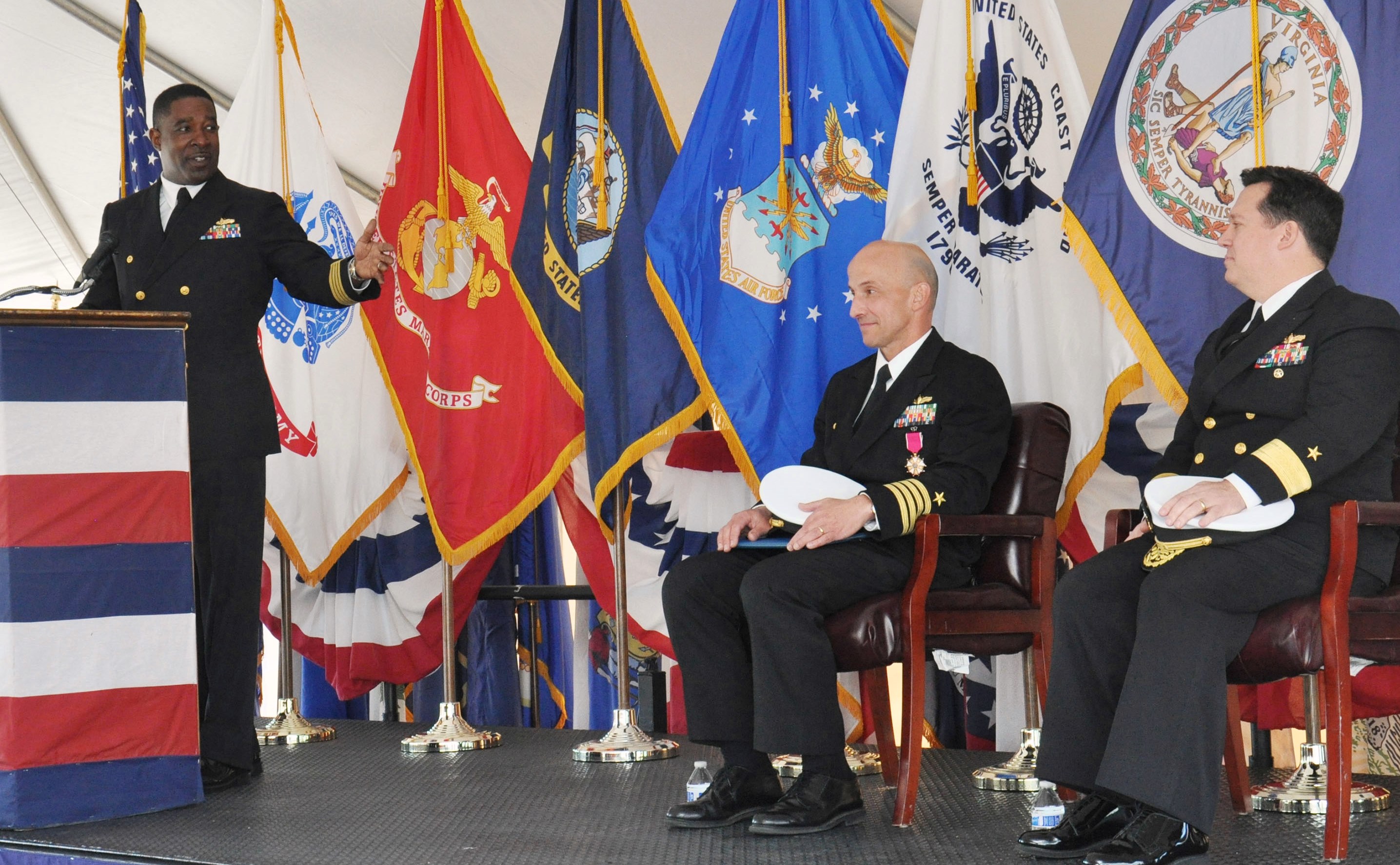 DAHLGREN, Va. (Nov. 18, 2016) - Capt. Godfrey Weekes, incoming commanding officer of Naval Surface Warfare Center Dahlgren Division (NSWCDD), thanks Capt. Brian Durant, center, outgoing NSWCDD commanding officer, during a change of command ceremony held at Naval Support Facility Dahlgren. Rear Adm. Tom Druggan, commander of the Naval Surface Warfare Center, right, was the ceremony's guest speaker. NSWCDD's mission is to provide research, development, test and evaluation, analysis, systems engineering, integration and certification of complex naval warfare systems related to surface warfare and strategic systems as well as combat and weapons systems associated with surface warfare. The command also provides system integration and certification for weapons, combat systems, and warfare systems. U.S. Navy photo by Andrew Revelos.