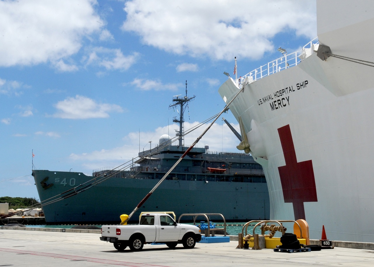GUAM (June 1, 2016) Military Sealift Command hospital ship USNS Mercy (T-AH 19) moored next to USS Frank Cable (AS-40) at Naval Base Guam as Mercy, prepares for Pacific Partnership 2016. Mercy's mission is designed to emphasize multilateral cooperation and building mutual trust in the Indo-Asia-Pacific region. Medical, engineering and various other personnel embarked aboard Mercy will work side-by-side with partner nations, exchanging ideas, building the best practices and relationships to ensure preparedness should disaster strike.