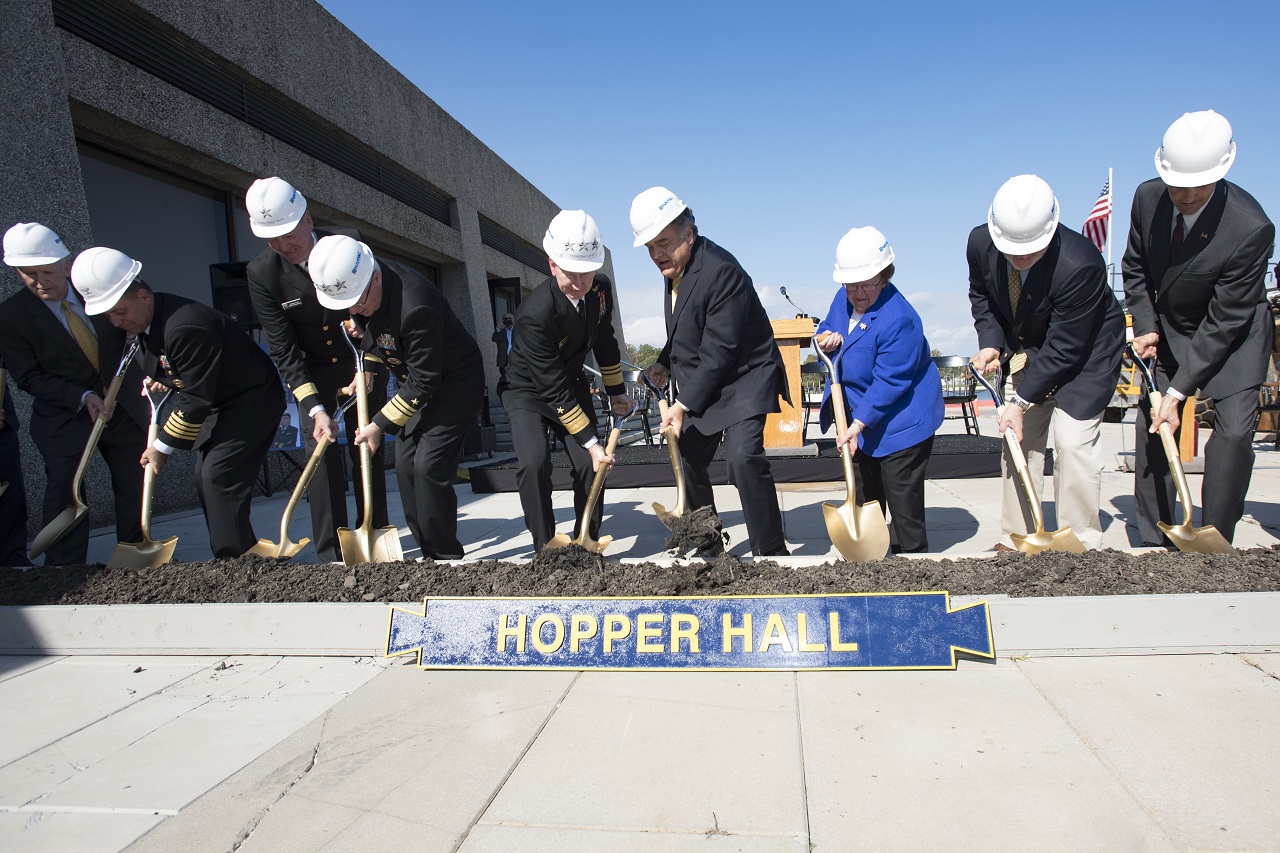 ANNAPOLIS, Md. (Oct. 21, 2016) The official part The official party of the Hopper Hall ground breaking ceremony at the United States Naval Academy (USNA) dig out a scoop of dirt. Hopper Hall, which will house USNA's Center for Cyber Studies, is the namesake of Rear Adm. Grace Hopper who is often referred to as 'The Mother of Computing'. U.S. Navy photo by Petty Officer 3rd Class Brianna Jones/Released 