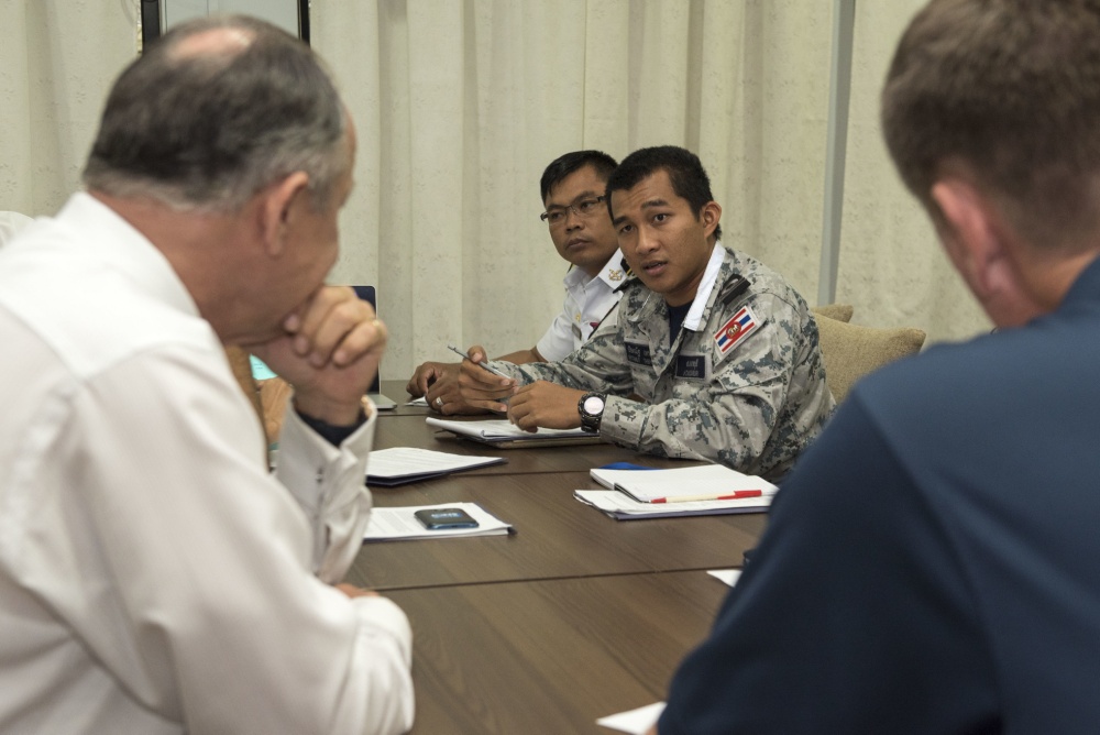 SINGAPORE (Aug. 19, 2016) Liaison officers from participating countries of Southeast Asia Cooperation and Training (SEACAT) 2016 review a training brief to prepare for the exercise at Yankee Station, Aug. 19. SEACAT is multilateral exercise held annually with nine participating countries including the United States, Brunei, Indonesia, Malaysia, the Philippines, Cambodia, Bangladesh, Singapore, and Thailand. U.S. Navy photo by Mass Communication Specialist 2nd Class Joshua Fulton/Released 