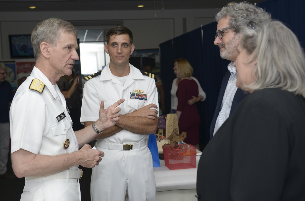 WASHINGTON (June 21, 2016) U.S. Navy Vice Adm. Philip Cullom, deputy CNO for fleet readiness and logistics, speaks with Prof. Neil Gershenfeld, director of MIT's Center for Bits and Atoms during the Capitol Hill Maker Faire in Washington, D.C. The Faire showcased robotics, drones, 3-D printing and printed art. U.S. Navy photo by Mass Communication Specialist 2nd Class Cyrus Roson/Released 