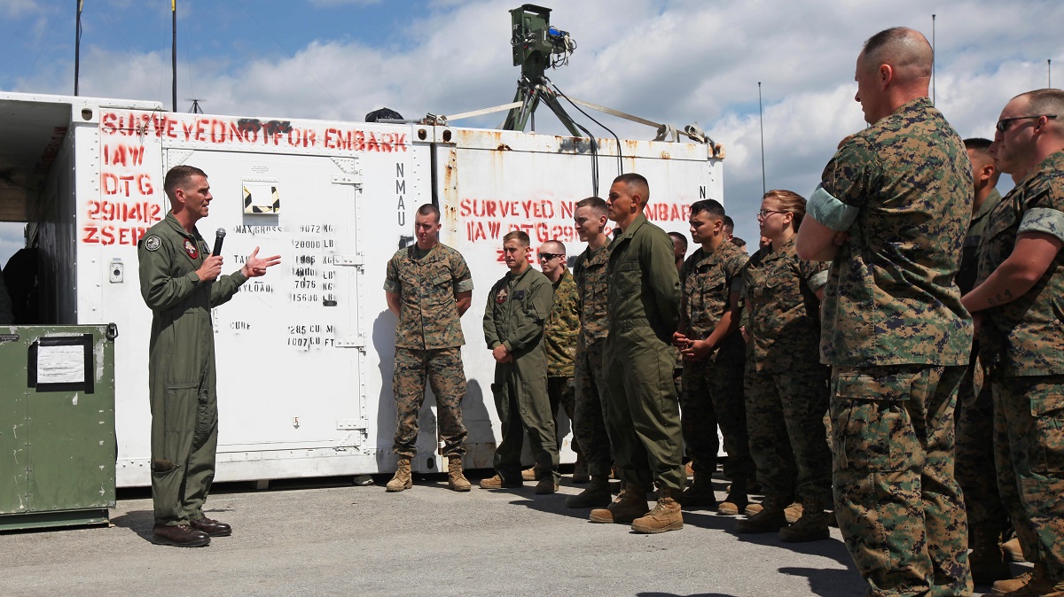 Lt. Col. Kris Faught speaks to Marines with Marine Unmanned Aerial Vehicle Squadron 2 before the first RQ-21A Blackjack flight into Class D airspace over Marine Corps Air Station Cherry Point, North Carolina, March 21, 2016. The RQ-21A Blackjack system is modular, flexible and multi-mission capable, providing roll-on, roll-off transitions between land and maritime environments. Faught is the commanding officer of VMU-2. 