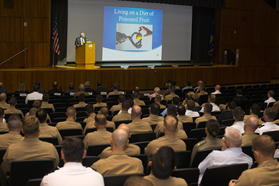 Former Secretary of the Navy the Honorable Richard Danzig speaks to NPS students, faculty and staff during a Secretary of the Navy Guest Lecture at King Auditorium, Feb. 9. Danzig offered insight into the national security implications of digital insecurity in a world where security must be built from essentially insecure components. Photo courtesy of NPS. 