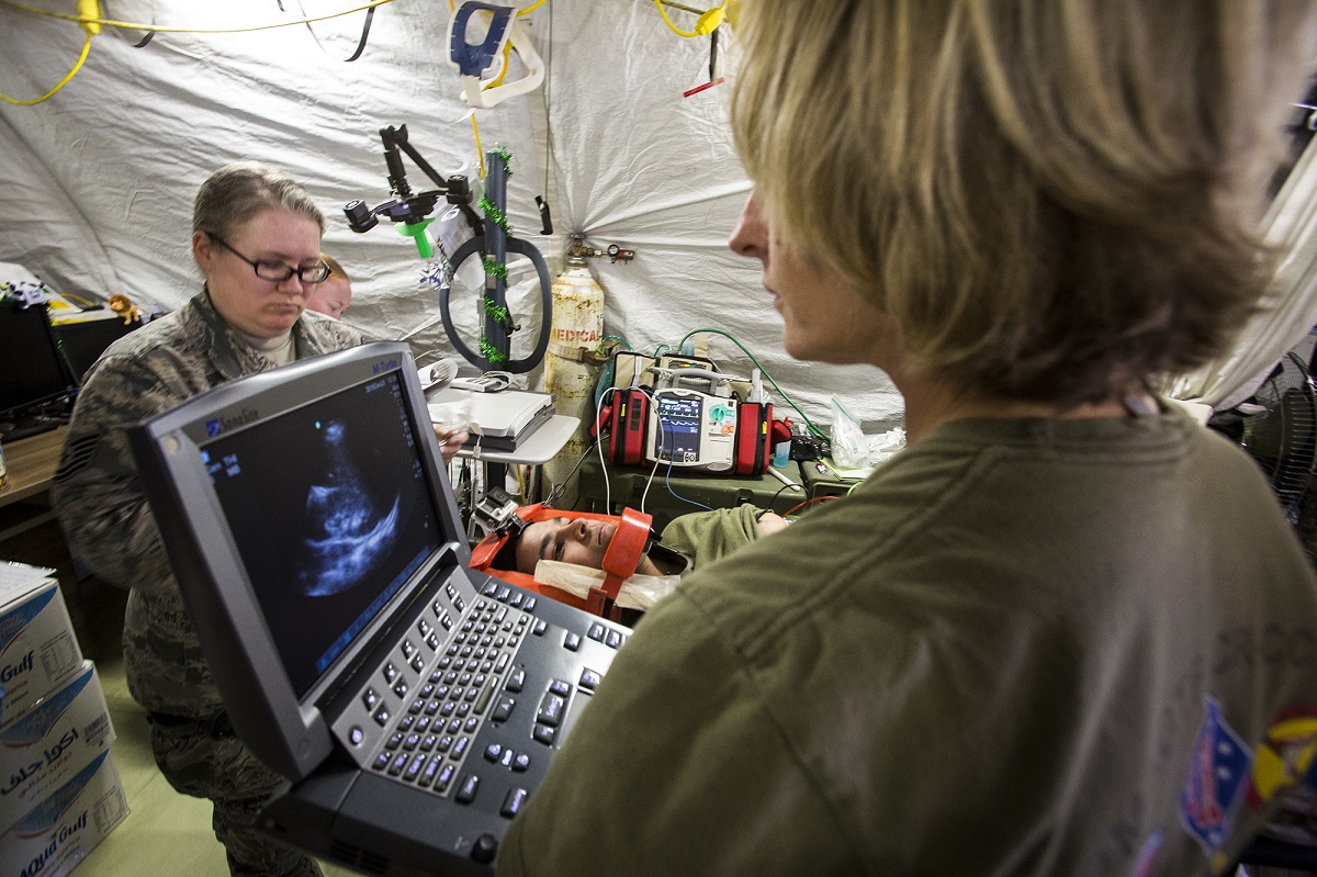 SOUTHWEST ASIA (Dec. 23, 2015) U.S. Navy and Air Force medical personnel treat a simulated casualty during a mass casualty exercise at an undisclosed location in Southwest Asia, Dec. 23, 2015. Canadian forces, U.S. Air Force and Army medical personnel, along with U.S. Marines and Navy corpsmen with Special Purpose Marine Air Ground Task Force - Crisis Response - Central Command, participated in the joint exercise to hone the coalition's medical response capabilities. SPMAGTF-CR-CC is currently deployed to the U.S. Central Command area of responsibility with a mission spanning 20 nations.  U.S. Marine Corps Photo by Sgt. Rick Hurtado 

