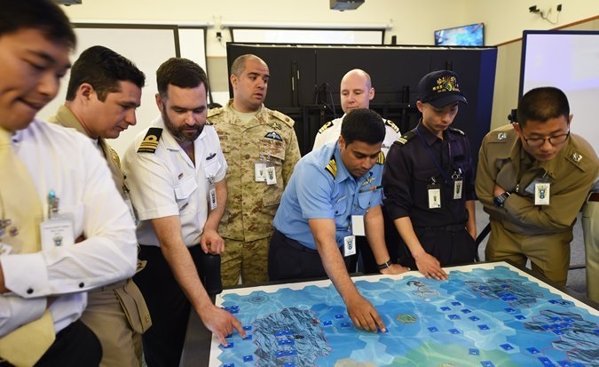 Members of coalition forces engage in the first war game designed to include an entire academic year into one exercise at the U.S. Naval War College in Newport, R.I. Students were divided into two fictitious teams from six coalition nations and tasked with securing fictitious "Green Island." Sixty-six naval officers from 48 countries participated in the exercise. Courtesy photo