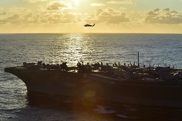ATLANTIC OCEAN (Nov. 29, 2015) An MH-60S Sea Hawk helicopter assigned to the Dusty Dogs of Helicopter Sea Combat Squadron (HSC) 7 flies toward the Military Sealift Command fleet replenishment oiler USNS Kanawha (T-AO 196) during a replenishment at sea with the aircraft carrier USS Dwight D. Eisenhower (CVN 69). Dwight D. Eisenhower, with embarked Carrier Air Wing 3, is underway conducting the Tailored Ship's Training Availability (TSTA) and Final Evaluation Problem (FEP) as part of the basic phase of the Optimized Fleet Response Plan. U.S. Navy photo by Mass Communication Specialist 3rd Class Jameson E. Lynch.