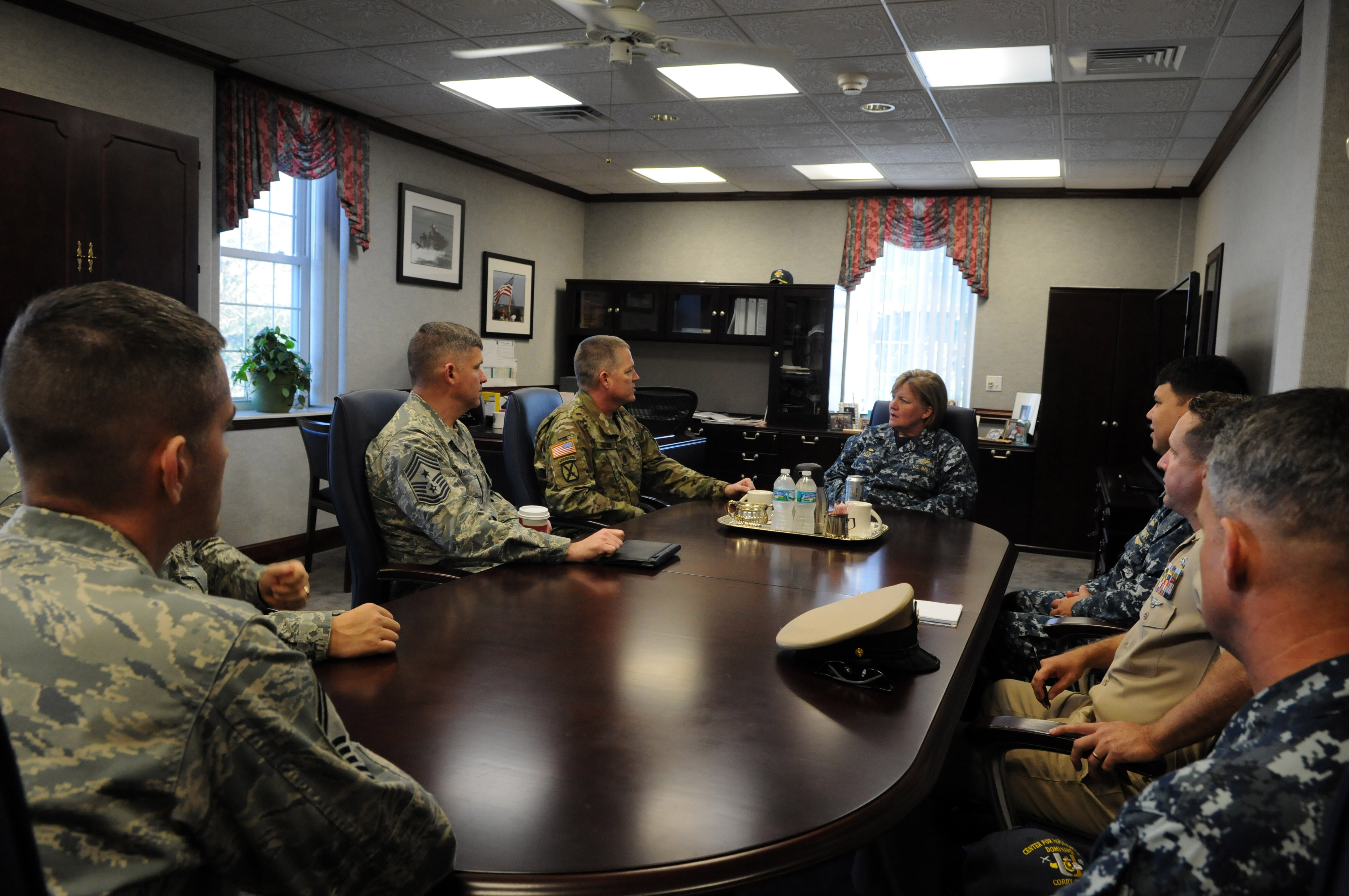 PENSACOLA, Fla. (Dec. 9, 2015) Command Sgt. Maj. David Redmon, National Security Affairs and U.S. Cyber Command senior enlisted leader, meets with Capt. Maureen Fox, Center for Information Dominance (CID) commanding officer, and her staff to discuss training.  CID is the Naval Education and Training Command learning center that leads, manages and delivers Navy and joint forces training in information operations, information warfare, information technology, cryptology and intelligence. Photo by Carla M. McCarthy.