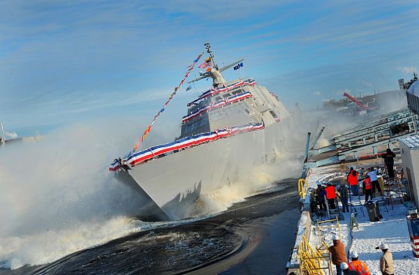 MARINETTE, Wis. (Dec. 18, 2013) The littoral combat ship Pre-Commissioning Unit (PCU) Milwaukee (LCS 5) slides into the Menominee River during a christening ceremony at the Marinette Marine Corporation shipyard. U.S. Navy photo courtesy of Lockheed Martin.