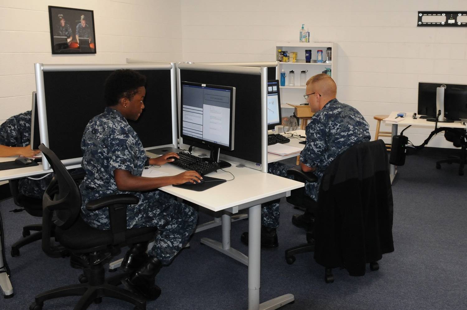 PENSACOLA, Fla. (July 31, 2015) Information systems technician students at the Center for Information Dominance Unit Corry Station learn with the artificial-intelligence-based Digital Tutor (DT).  Using a chat-style interface, DT communicates with each student one-on-one and also monitors, processes and coaches student responses as an actual tutor would through a series of highly interactive, progressively challenging troubleshooting exercises. The DT Course teaches network administration, database management, and computer hardware and software troubleshooting skills. U.S. Navy photo by Thomas Seith 