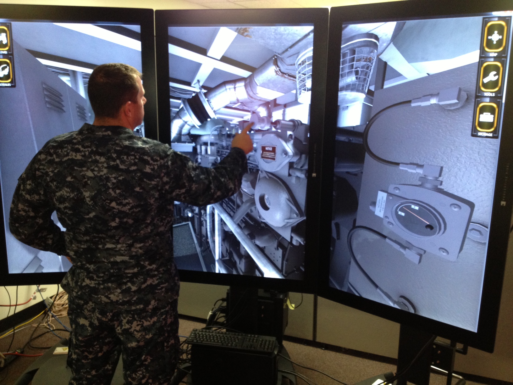 The Multipurpose Reconfigurable Training System (MRTS) 3D, which is currently being used by military personnel, is a PC-based system with 30-inch single-touch and 55-inch multi-touch liquid crystal display screens that simulate tactical equipment for weapons, machinery and communications training. Multipurpose Reconfigurable Training System 3D and MRTS 3D are trademarks of the U.S. Navy. U.S. Navy photo.