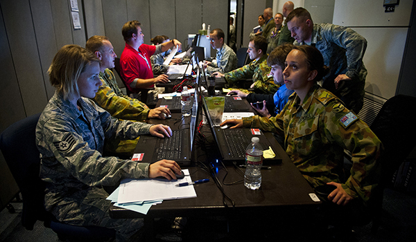 The Red Flag 14-1 Cyber Protection Team works on defense procedures inside the Combined Air and Space Operations Center-Nellis during an exercise. The CPT’s primary goal is to find and thwart potential space, cyberspace and missile threats against U.S. and allied forces. U.S. Air Force photo by Senior Airman Brett Clashman.
