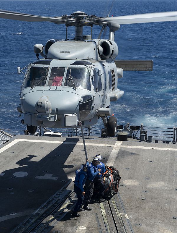 PACIFIC OCEAN (Oct. 29, 2014) Sailors aboard the Oliver Hazard Perry-class guided-missile frigate USS Vandegrift (FFG 48) hook a cargo cable to an SH-60B Sea Hawk helicopter from Helicopter Anti-Submarine Light Squadron (HSL) 49 during a vertical replenishment training exercise. Vandegrift is on its last scheduled deployment before being decommissioned in March 2015. The ship is on patrol in the U.S. 4th Fleet area of responsibility. U.S. Navy photo by Mass Communication Specialist 3rd Class Cory Booth.