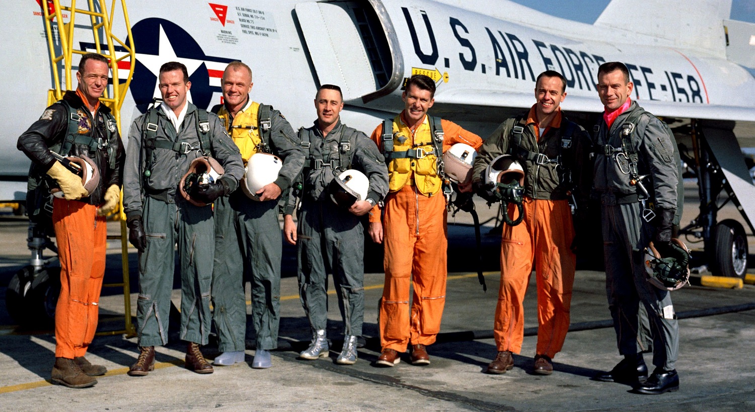 Standing beside a Convair F106-B aircraft in a January 1961 photograph are the nation's Project Mercury astronauts. Left to right, are M. Scott Carpenter, L. Gordon Cooper Jr., John H. Glenn Jr., Virgil I. "Gus" Grissom, Walter M. Schirra Jr., Alan B. Shepard Jr. and Donald K. "Deke" Slayton. Image Credit: NASA.
