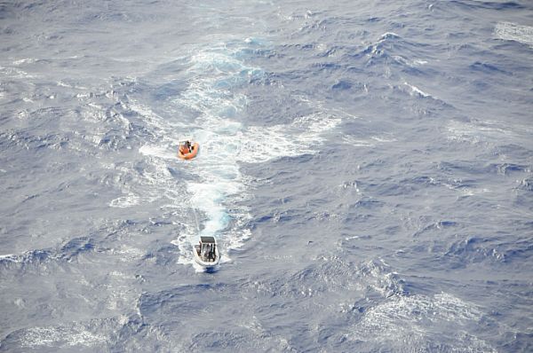 SONGSONG, Rota (Feb. 5, 2015) Sailors from Helicopter Sea Combat Squadron (HSC) 25, U.S. Coast Guard Sector Guam and rescue crews from Rota recovered three stranded boaters a mile offshore near the village of Songsong. Photo courtesy of U.S. Navy.