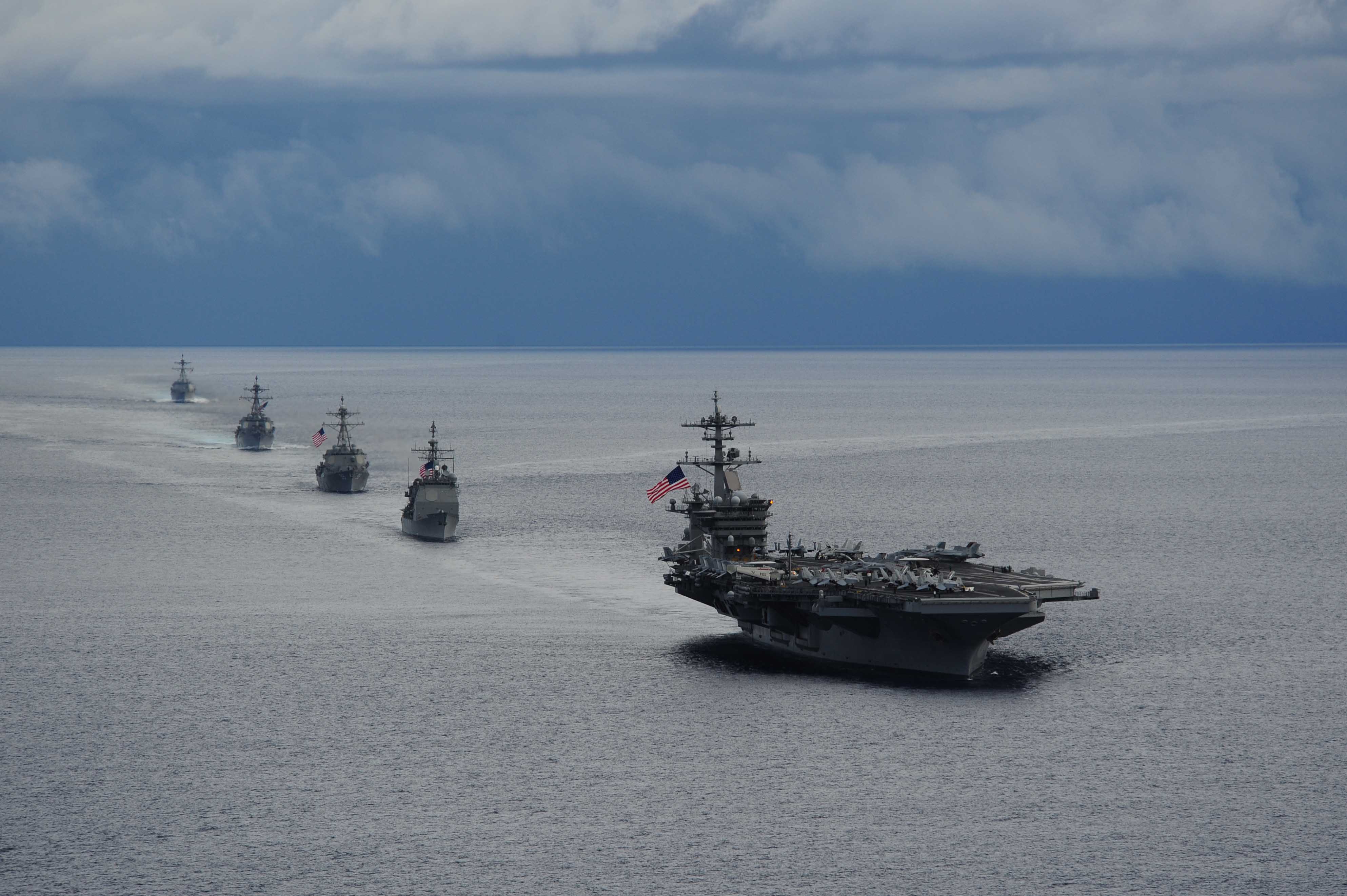 ATLANTIC OCEAN (Sept. 23, 2014 ) The aircraft carrier USS Theodore Roosevelt (CVN 71) leads a formation of ships from Carrier Strike Group (CSG) 12 during a maneuvering exercise. Theodore Roosevelt participated in the exercise with the Peruvian submarine BAP Islay (SS 35), the guided-missile destroyers USS Winston Churchill (DDG 81), USS Forrest Sherman (DDG 98), USS Farragut (DDG 99) and the guided-missile cruiser USS Normandy (CG 60). Theodore Roosevelt is underway preparing for future deployments. Photo by Mass Communication Specialist 2nd Class Katie Lash.