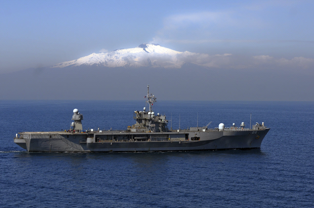 MEDITERRANEAN SEA (March 25, 2011) The U.S. 6th Fleet flagship USS Mount Whitney (LCC/JCC 20) is underway past Mount Etna supporting Joint Task Force Odyssey Dawn. Odyssey Dawn is the U.S. Africa Command task force established to provide operational and tactical command and control of U.S. military forces supporting the international response to the unrest in Libya and enforcement of United Nations Security Council Resolution (UNSCR) 1973. U.S. Navy photo by Mass Communication Specialist 2nd Class Daniel Viramontes.