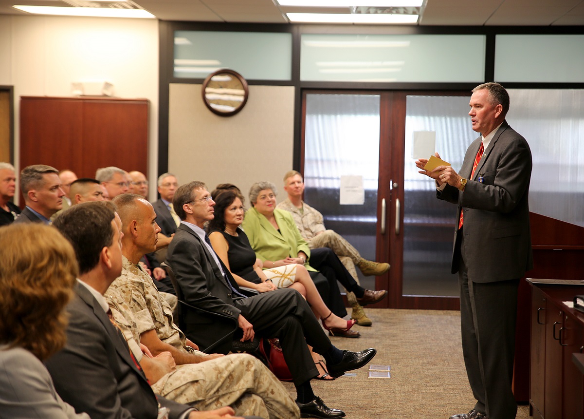 William “Bill” Taylor, Program Executive Officer Land Systems and a member of the Senior Executive Service, speaks to the audience during a Change of Leadership ceremony June 21 aboard Marine Corps Base Quantico. Taylor — who has served as the Marine Corps’ only PEO since 2007—relinquished his duties after being selected as the next assistant deputy commandant for Sustainment for Marine Corps Aviation.  U.S. Marine Corps photo by Monique Randolph