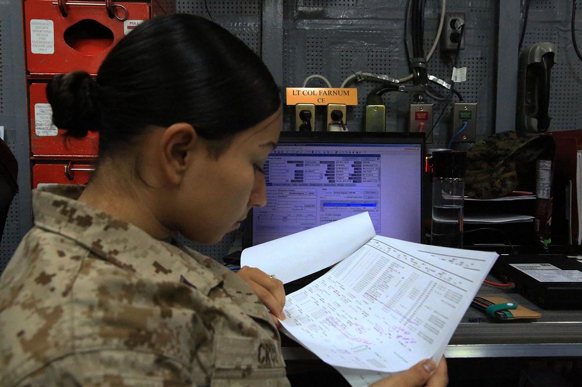 Interim solution making huge impact to Marine Corps supply chain management - U.S. Marine Cpl. Didivalis Cruz, maintenance management clerk with 13th Marine Expeditionary Unit, reviews task and transaction records kept using the Global Combat Support System-Marine Corps. In preparation for the GCSS-MC’s Release 12 software update, the GCSS-MC program management office released the Temporary R11 Instance, or TRI, to allow more time for testing of the R12 instance and to decrease risk at go-live and for develop training aides. As a bonus TRI will provide three of the four essential milestones necessary before the release of R12 bringing increased ‘under the hood’ capabilities. U.S. Marine Corps photo by Sgt. Jennifer Pirante 
