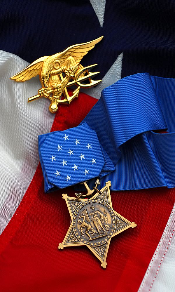 WASHINGTON (March 14, 2008) Actual Medal of Honor prepared for presentation posthumously to Master-at-Arms 2nd Class (SEAL) Michael A. Monsoor who sacrificed himself to save his teammates during combat operations in Iraq, Sept. 29, 2006. Medal is pictured with the Navy Special Warfare (SEAL) Trident. Monsoor's parents will accept the nation's highest military honor on behalf of their son during a White House ceremony April 8. Monsoor is the first Navy SEAL to earn the Medal of Honor for actions in Iraq and the second Navy SEAL to receive the award since Sept. 11, 2001. Monsoor is the fourth armed forces service member to receive the Medal of Honor since the beginning of Operations Enduring Freedom and Iraqi Freedom. U.S. Navy photo by Oscar Sosa.