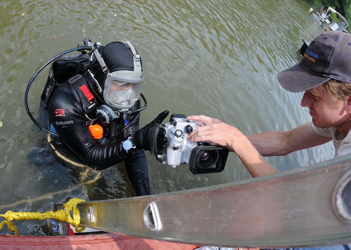 (Aug. 6, 2010) Underwater archeologists prepare to dive and document USS Scorpion, a War of 1812 vessel scuttled in the Patuxent River to avoid capture by British forces. This site is actively studied by UAB, and remote sensing surveys continue in order to find other wrecks associated with the Chesapeake Flotilla. U.S. Navy photo by Mass Communication Specialist 2nd Class Kenneth G. Takada 