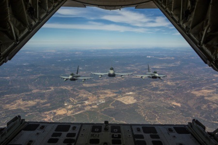 Three Eurofighter Typhoons with the Spanish Air Force escort a U.S. Marine Corps KC-130J Hercules during an aerial refueling mission, Aug. 13, in Spain. Bilateral exercises such as this one are how Spain and the U.S. foster one of the closest defense partnerships around the world. U.S. Marine Corps photo by Staff Sgt. Vitaliy Rusavskiy 