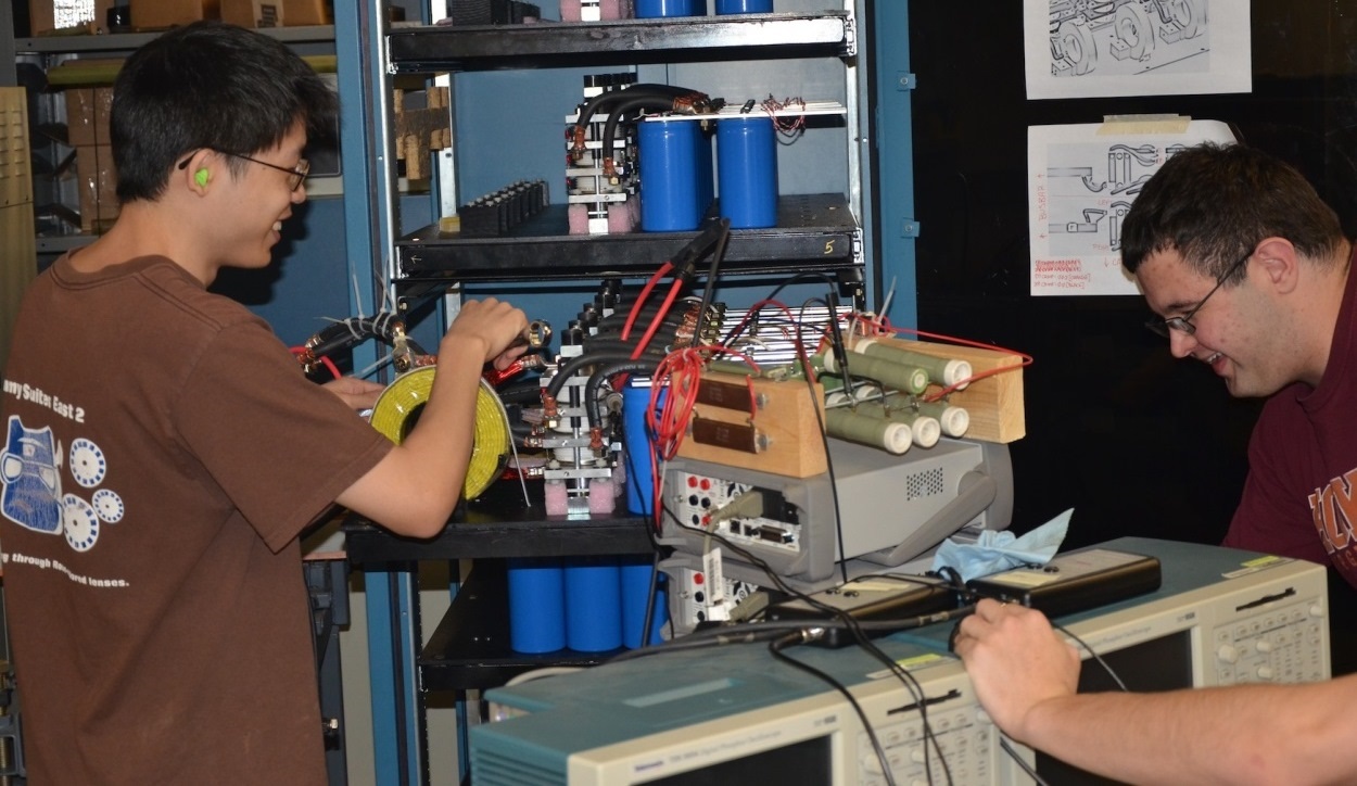 BLACKSBURG, Va. - Students assemble components of Virginia Tech's electromagnetic railgun pulse forming network at the university's Energy Conversion Systems Laboratory. Naval Surface Warfare Center Dahlgren Division (NSWCDD) railgun experts have been advising Virginia Tech students and professors since 2011. "The experience the student gains at Virginia Tech working on relevant railgun work is directly applicable to the skill sets we need to transition this technology into a reality for the Navy," said Chris Reichart, NSWCDD Pulsed Power Branch head.  