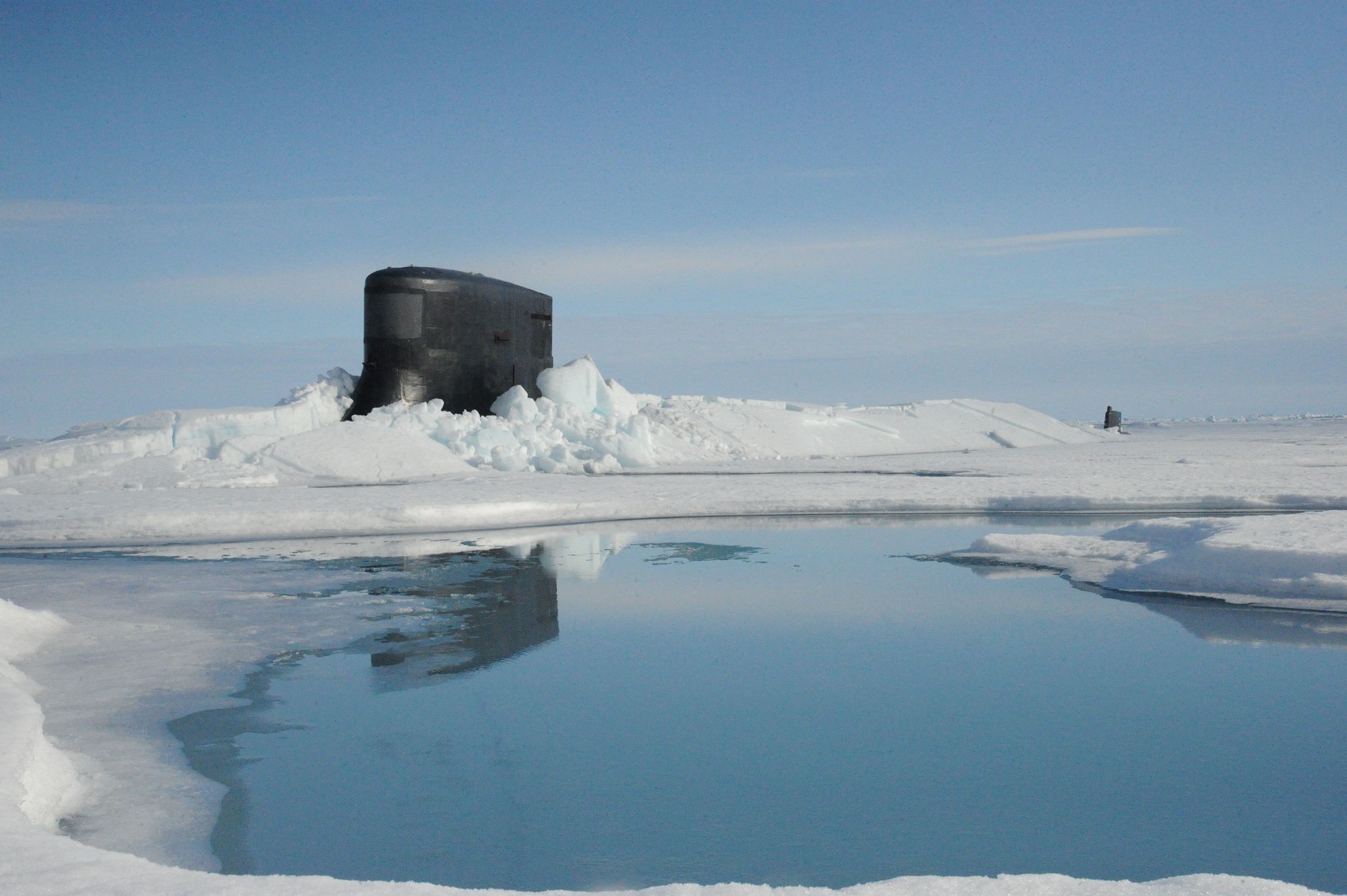 ARCTIC OCEAN (July 30, 2015) The fast attack submarine USS Seawolf (SSN 21) surfaces through Arctic ice at the North Pole. Seawolf conducted routine Arctic operations. U.S. Navy photo 