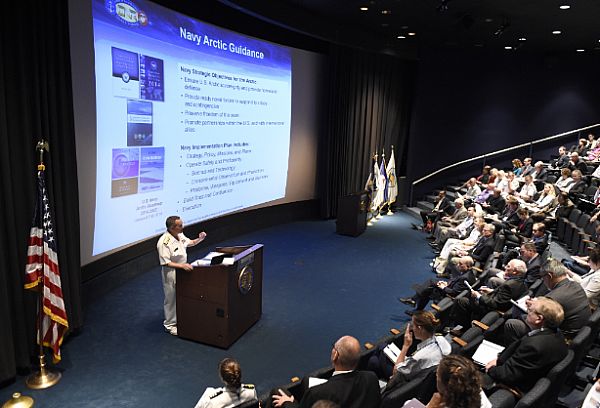 ARLINGTON, Va. (July 14, 2015) Chief of Naval Research Rear Adm. Mat Winter paints a portrait of naval operations in a challenging Arctic environment July 14 at the 6th Symposium on the Impacts of an Ice-Diminishing Arctic on Naval and Maritime Operations held at the Naval Heritage Center in Washington. Winter discussed ONR's investments in Arctic science, stressing the importance of international partnership and science and technology diplomacy. U.S. Navy photo by John F. Williams.